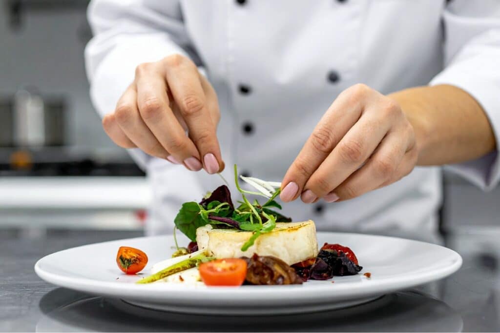 Chef Adding Finishing Touches to Elevated Meal