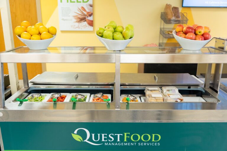 A buffet table showcasing a colorful assortment of fresh fruits and vegetables arranged for display.
